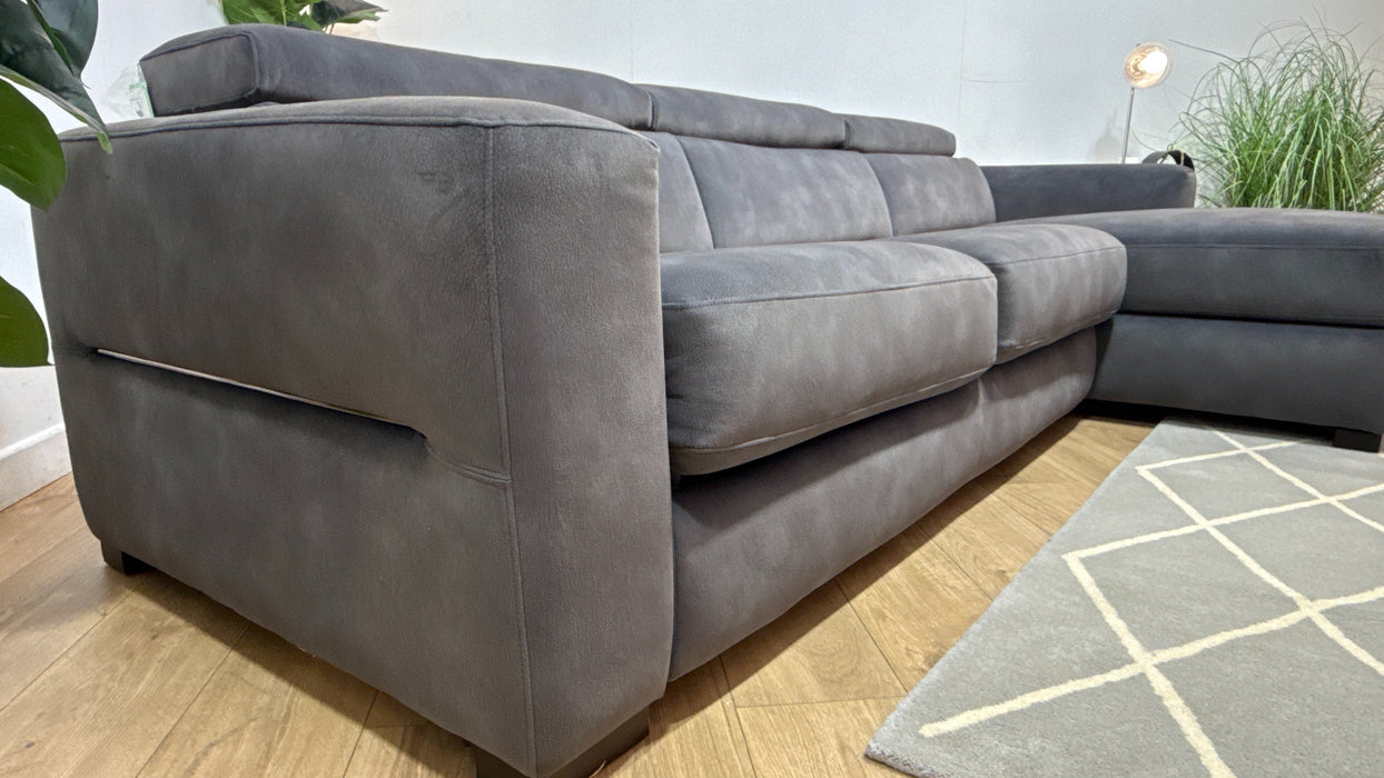 Sofology Metropolitan Fabric 4 Seater Chaise Sofa Bed with Storage in Lifestyle Mottled Charcoal