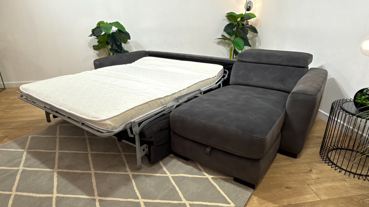 Sofology Metropolitan Fabric 4 Seater Chaise Sofa Bed with Storage in Lifestyle Mottled Charcoal