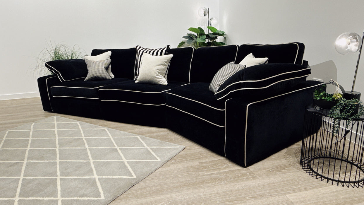 Sofology Atelier 4 Seater Full Back Asymmetrical in soft chenille ebony mix with pearl contrast piping