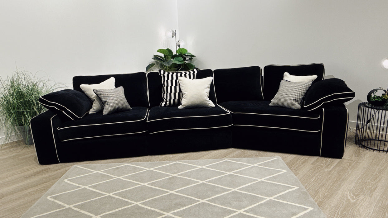 Sofology Atelier 4 Seater Full Back Asymmetrical in soft chenille ebony mix with pearl contrast piping