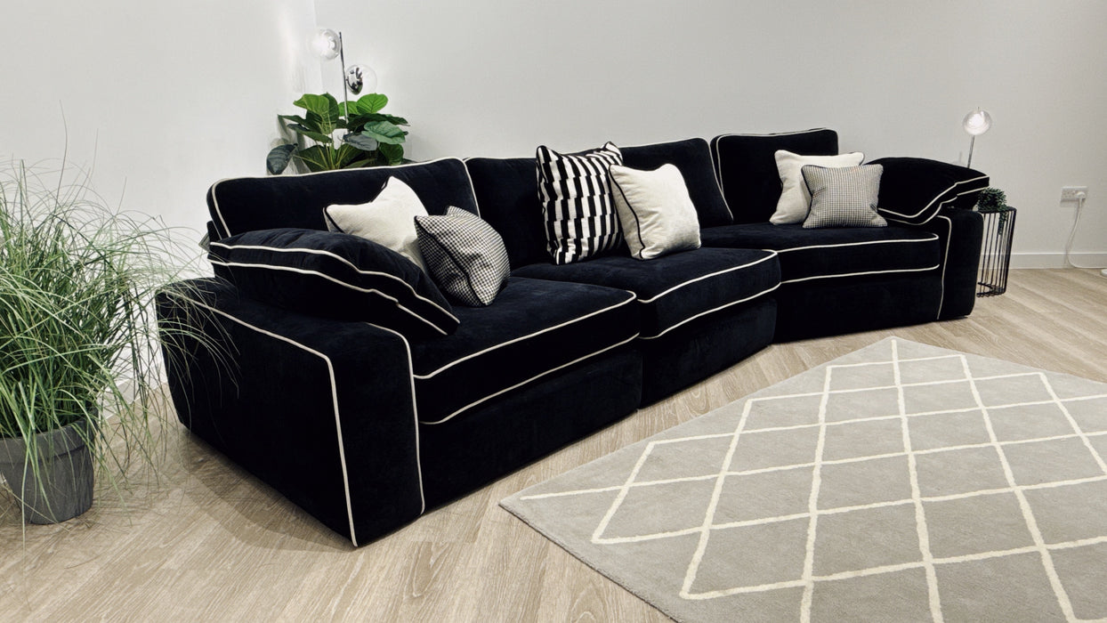 Sofology Atelier 4 Seater Full Back Asymmetrical in soft chenille ebony mix with pearl contrast piping