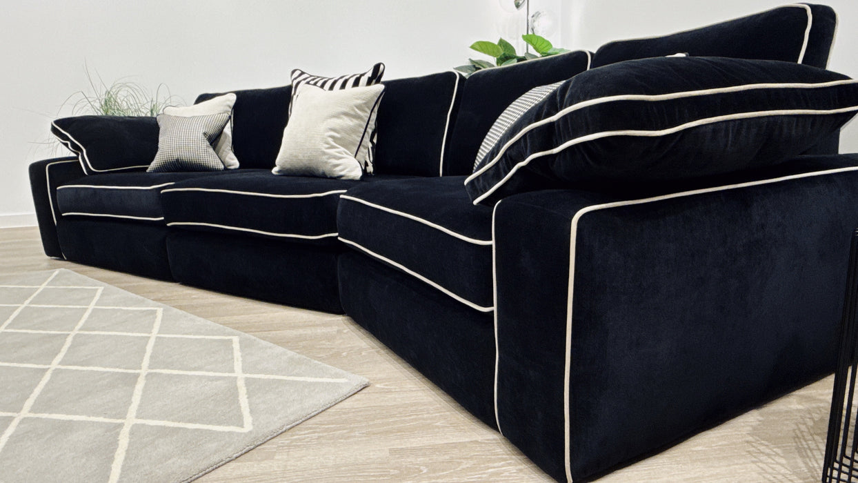 Sofology Atelier 4 Seater Full Back Asymmetrical in soft chenille ebony mix with pearl contrast piping