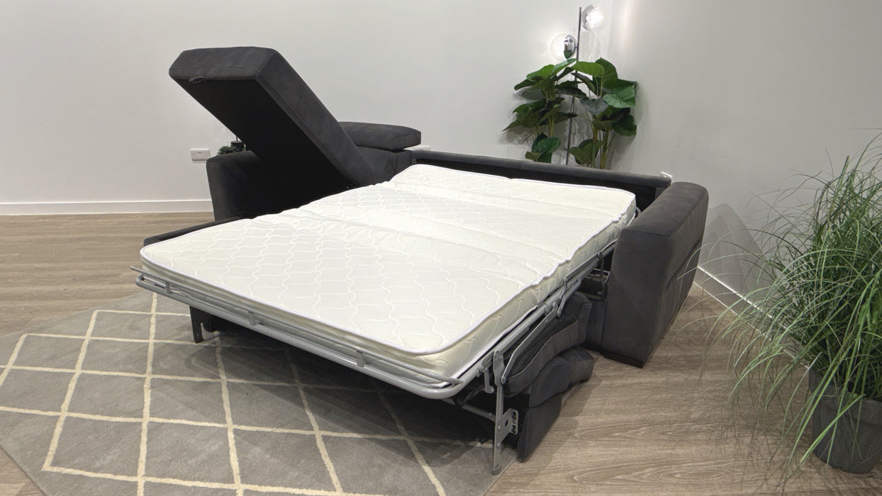 Sofology Metropolitan Fabric Chaise 4 Seater Sofa Bed with Storage in Lifestyle Mottled Charcoal
