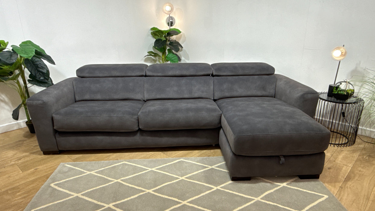 Sofology Metropolitan Fabric 4 Seater Chaise Sofa Bed with Storage in Lifestyle Mottled Charcoal
